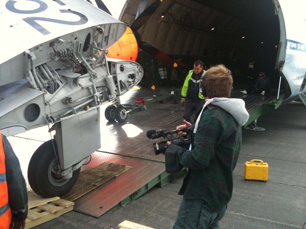 Discovery's Mega Move film crew covering loading into AN124